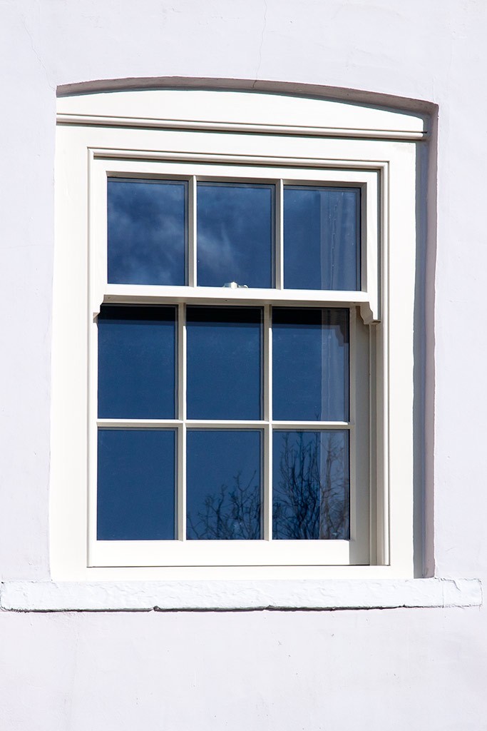 Sliding sash window in a three over six configuration